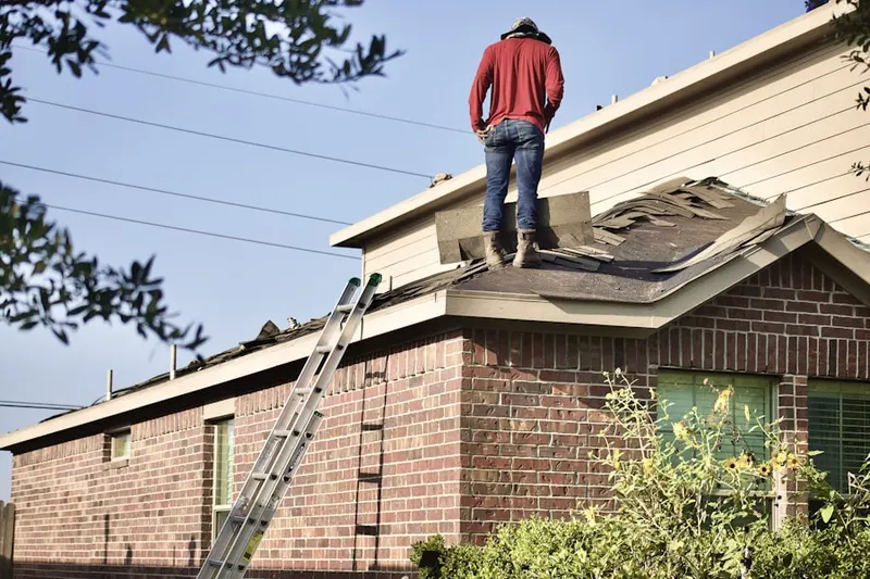 Professional roofer working on a residential roof in Paloma Creek South